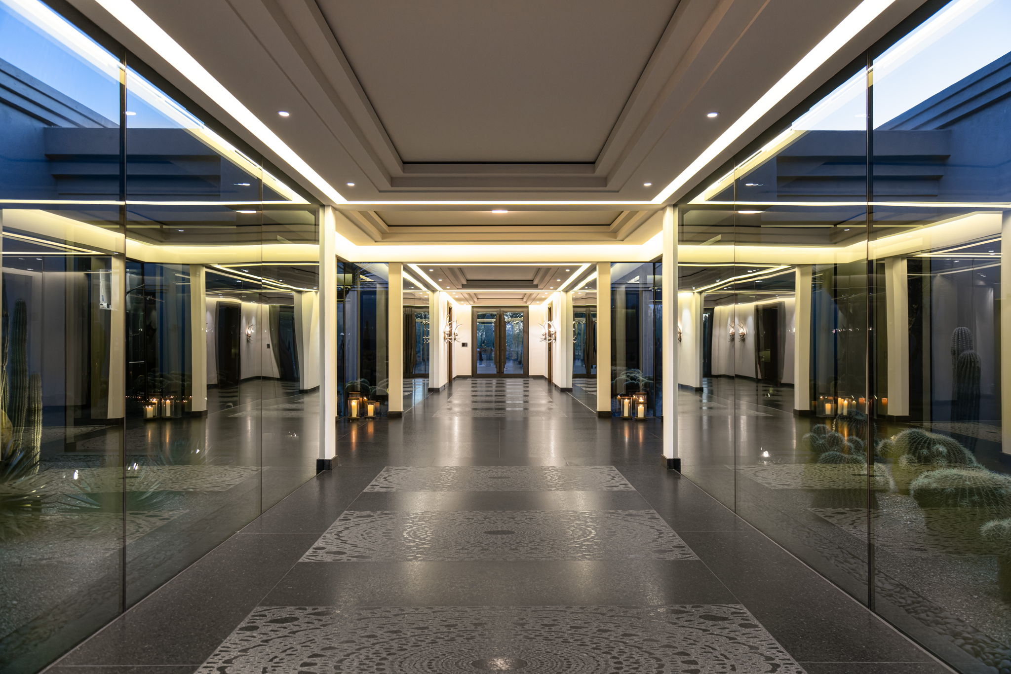Canyon Ranch Estate — mirrored entry foyer at dusk