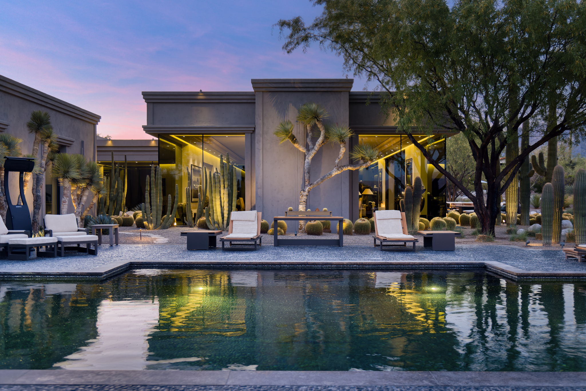 Canyon Ranch Estate — pool at dusk with golden interior light