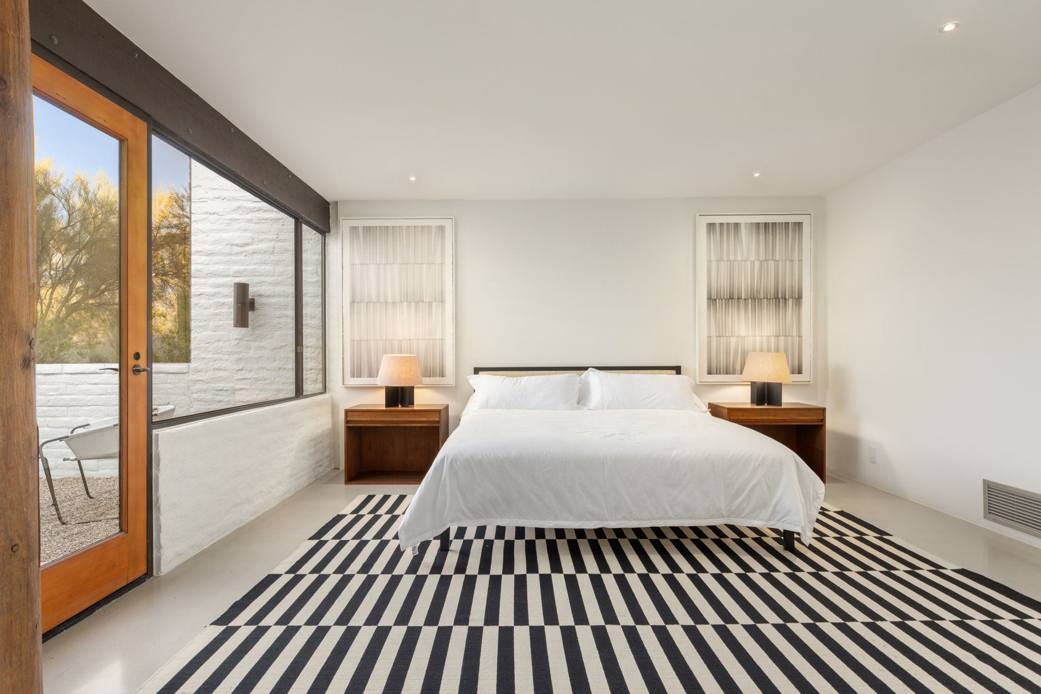 The Ramada House — primary bedroom with desert light