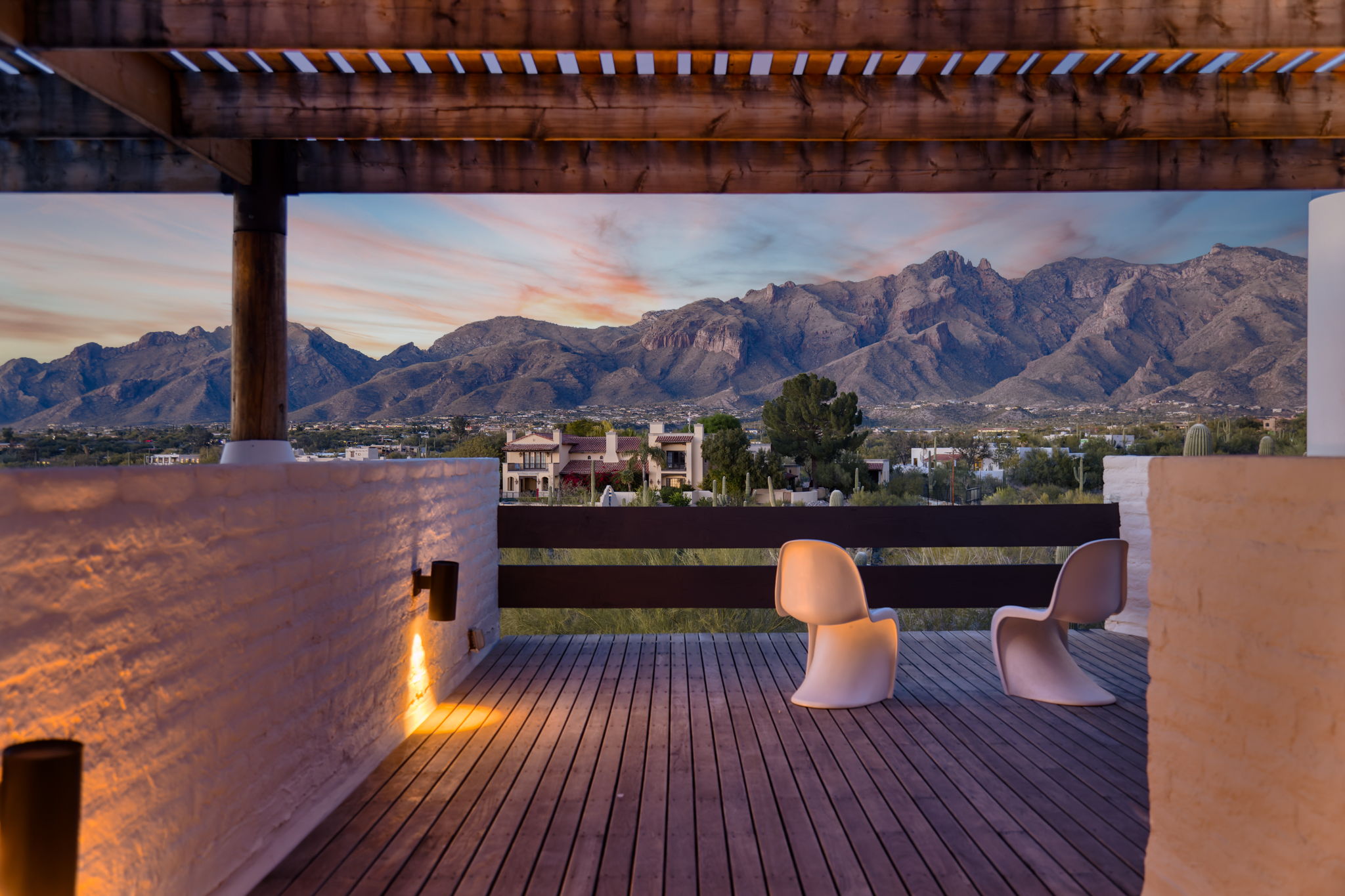 The Ramada House — upper terrace with Panton chairs, Catalinas at sunset