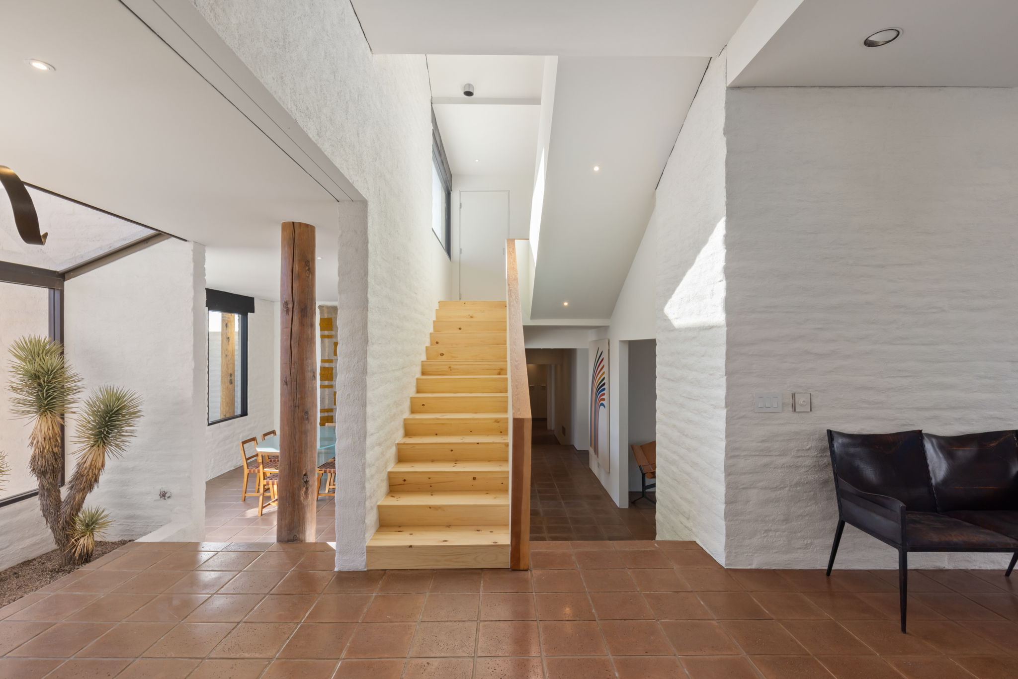 The Ramada House — staircase with exposed timber column