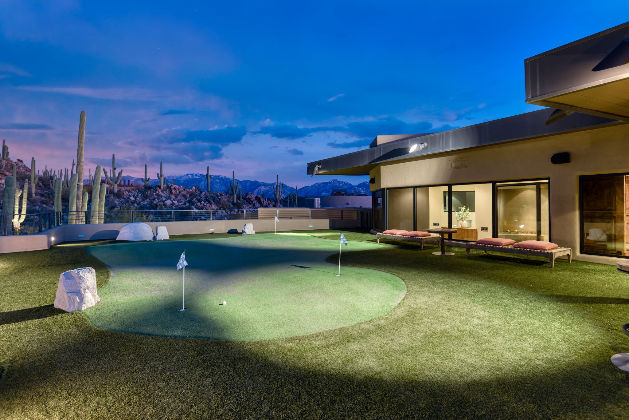 Tortolita Mountain Residence — putting green at dusk with Catalina mountain backdrop