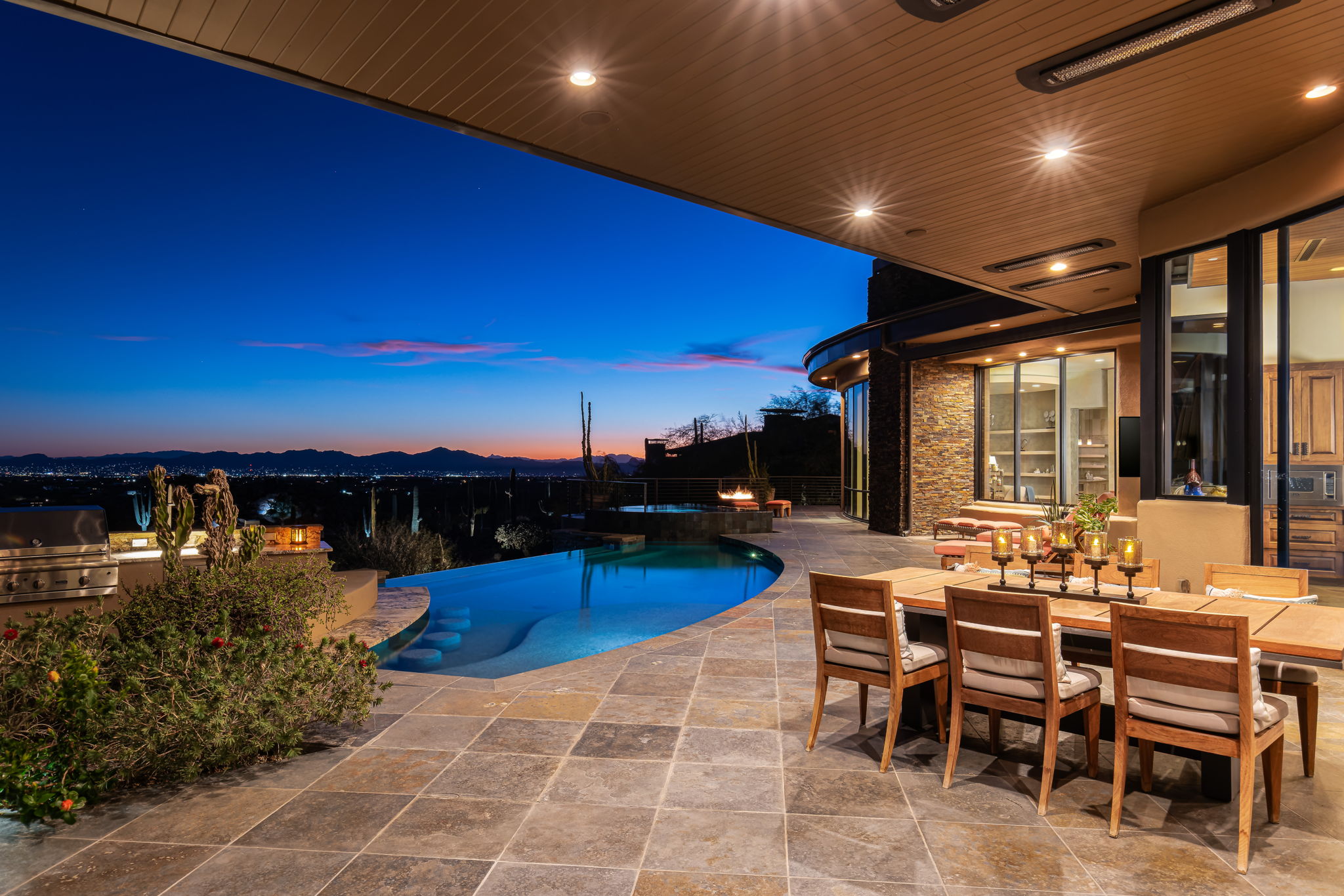 Tortolita Mountain Residence — patio at dusk with sunset over the Tucson valley