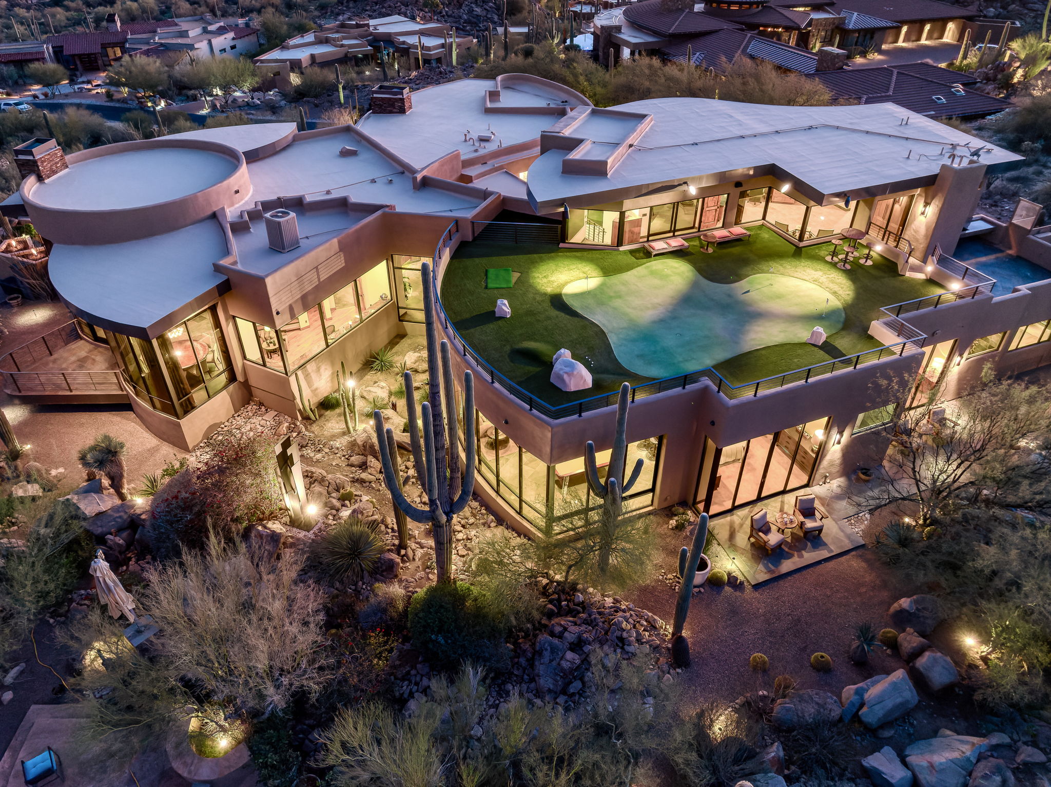 Tortolita Mountain Residence — overhead aerial showing rooftop putting green and Catalinas